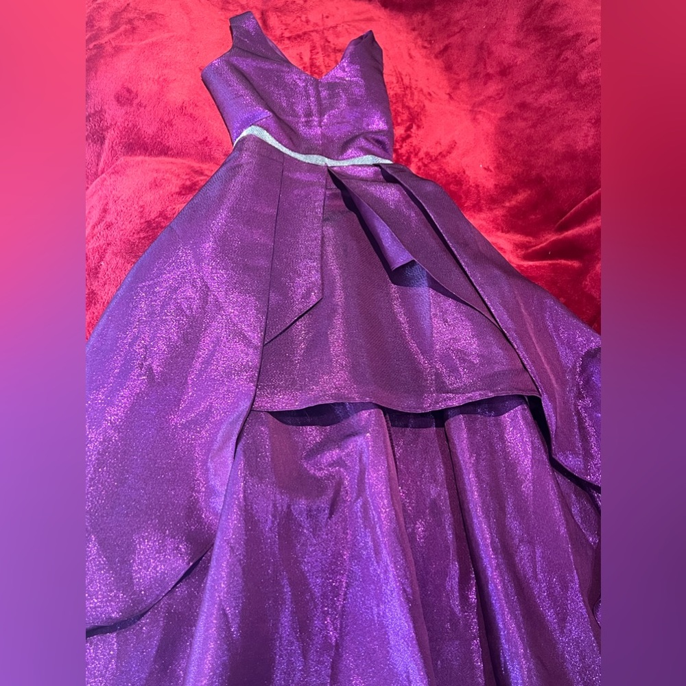 Beautiful purple dress worn with embellishment on the waist. Size 10
